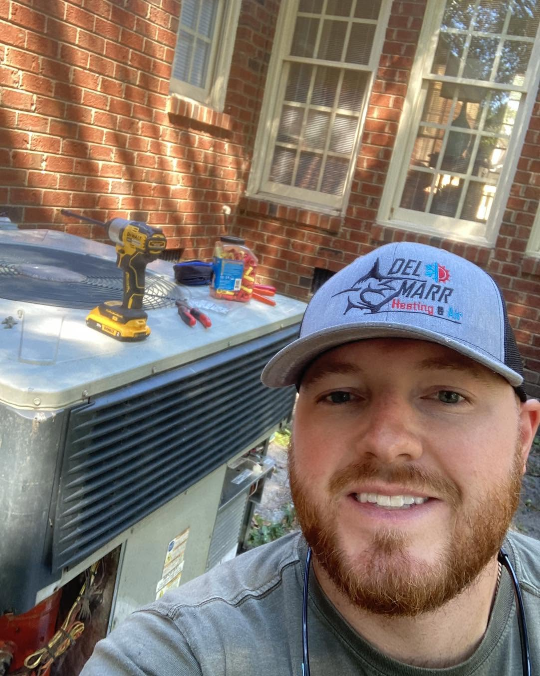 Aaron Marr working on residential HVAC equipment