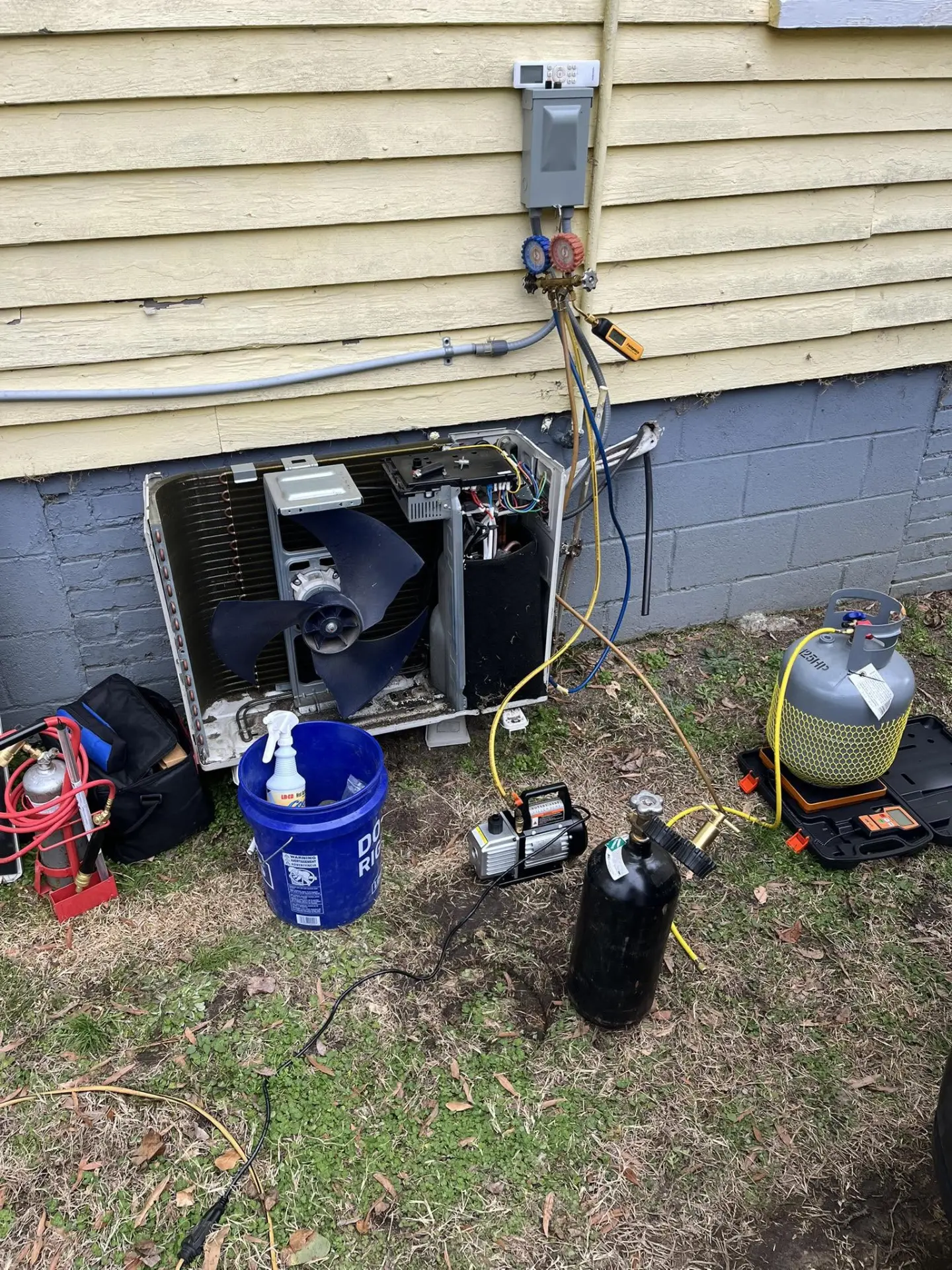 Residential air conditioning repair in progress